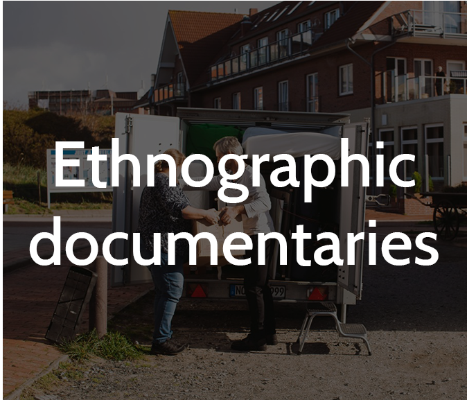 Ethnography documentary title. People in background 